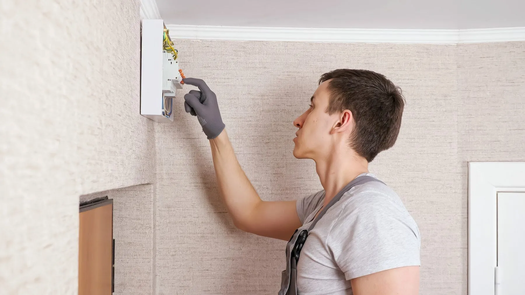 Technicians inspecting electrical equipment during a repair